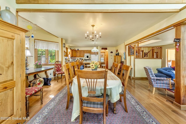 2555 County Highway 22, Exeter, NY 13315 - dining area featuring light wood-style flooring and a chandelier
