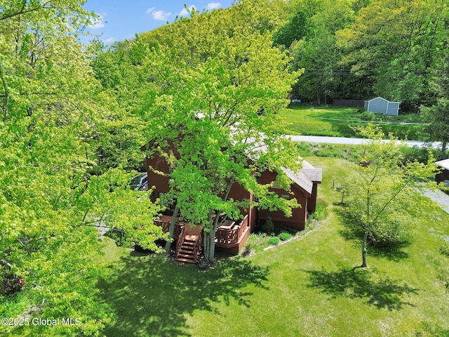 2555 County Highway 22, Exeter, NY 13315 - view of grassy yard with a wooden deck and a wooded view