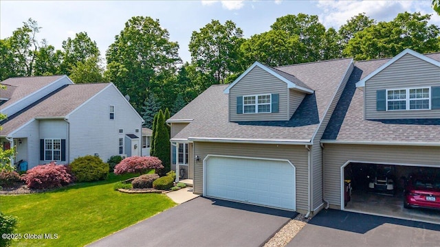 41A Raylinsky Ln, Halfmoon, NY 12118 - view of front of house featuring a shingled roof, a front yard, driveway, and a garage
