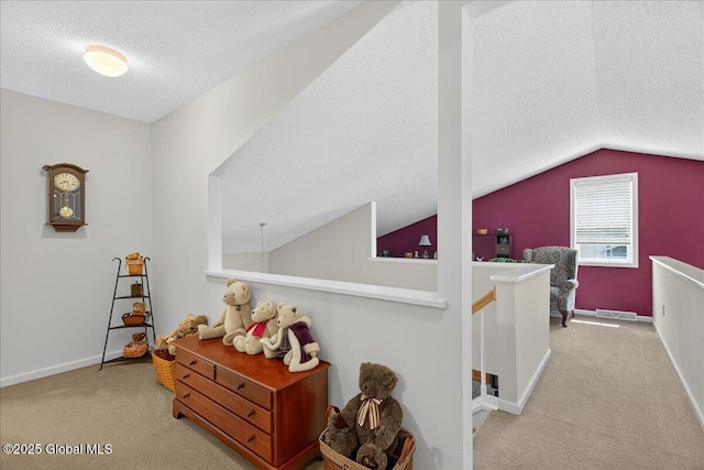 41A Raylinsky Ln, Halfmoon, NY 12118 - corridor with a textured ceiling, carpet flooring, lofted ceiling, and an upstairs landing