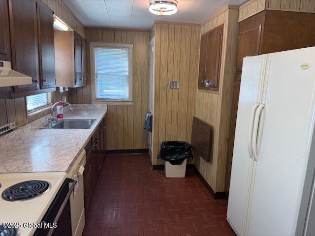 12 Birch Ave, Colonie, NY 12205 - kitchen with white appliances, ventilation hood, light countertops, and wooden walls