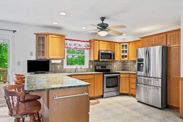 15 Iris Ave, Moreau, NY 12803 - kitchen with appliances with stainless steel finishes, plenty of natural light, a sink, a peninsula, and recessed lighting