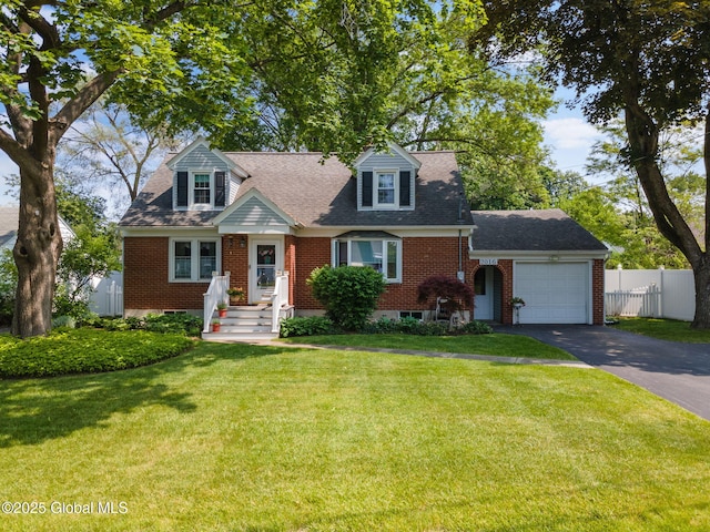 2016 Careleon Rd, Rotterdam, NY 12303 - cape cod home featuring driveway, a garage, brick siding, and roof with shingles