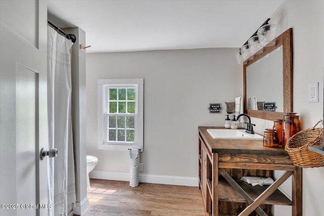 212 County Route 70, Stillwater, NY 12170 - full bath with toilet, vanity, wood finished floors, baseboards, and curtained shower