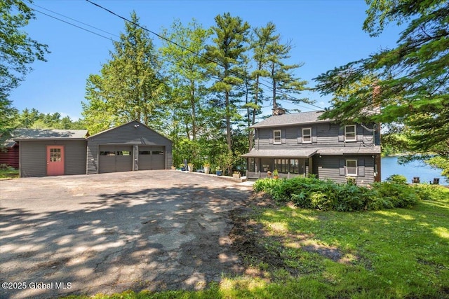 162 Methodist Farm Rd, Sand Lake, NY 12018 - view of front of property with an outbuilding, a sunroom, a chimney, and a garage