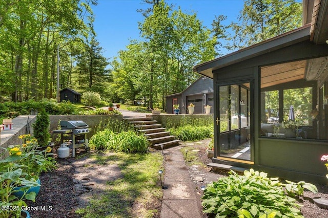 162 Methodist Farm Rd, Sand Lake, NY 12018 - view of yard with a sunroom, a storage unit, and stairs