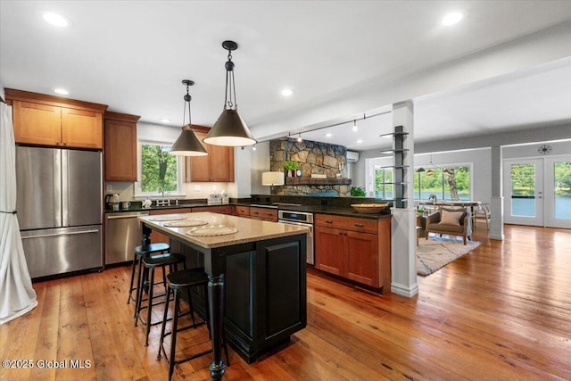 162 Methodist Farm Rd, Sand Lake, NY 12018 - kitchen featuring appliances with stainless steel finishes, a peninsula, plenty of natural light, hardwood / wood-style floors, and recessed lighting