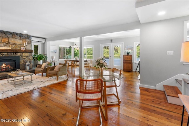 162 Methodist Farm Rd, Sand Lake, NY 12018 - dining area featuring a wall mounted air conditioner, plenty of natural light, and wood-type flooring