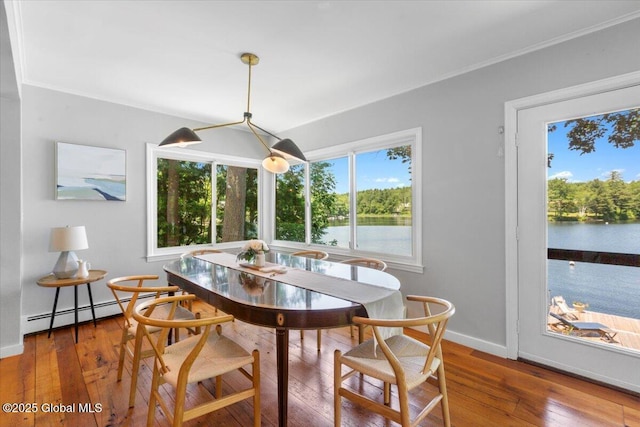 162 Methodist Farm Rd, Sand Lake, NY 12018 - dining area with wood-type flooring, baseboard heating, a water view, and crown molding