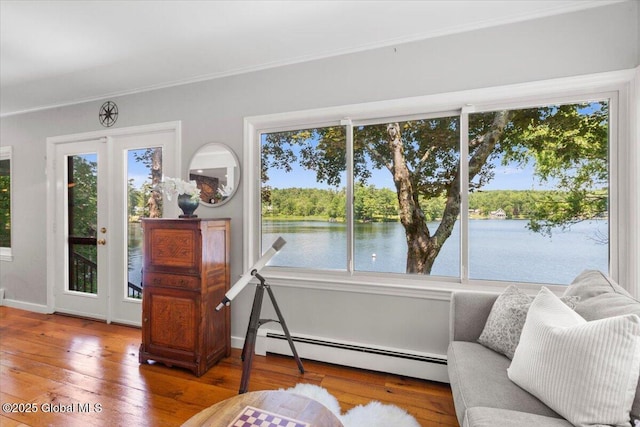 162 Methodist Farm Rd, Sand Lake, NY 12018 - sitting room featuring a baseboard radiator, hardwood / wood-style floors, a water view, and crown molding
