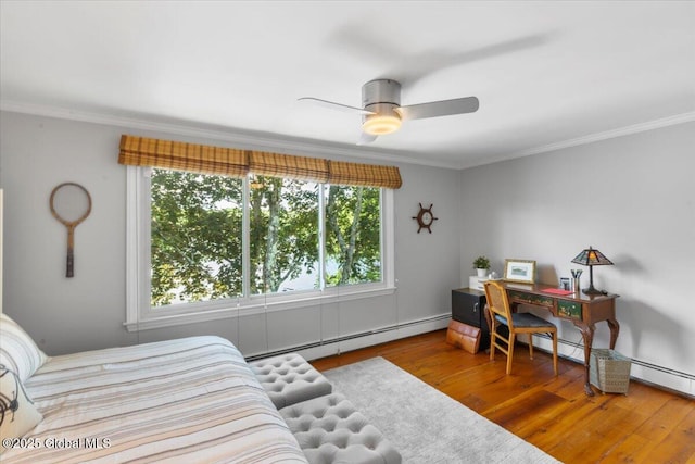 162 Methodist Farm Rd, Sand Lake, NY 12018 - bedroom with baseboard heating, wood finished floors, crown molding, and a ceiling fan
