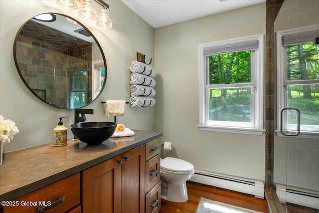 162 Methodist Farm Rd, Sand Lake, NY 12018 - full bathroom featuring a baseboard radiator, vanity, tiled shower, and wood finished floors