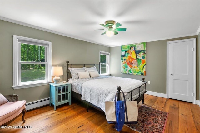 162 Methodist Farm Rd, Sand Lake, NY 12018 - bedroom featuring a baseboard radiator, light wood finished floors, crown molding, and a ceiling fan
