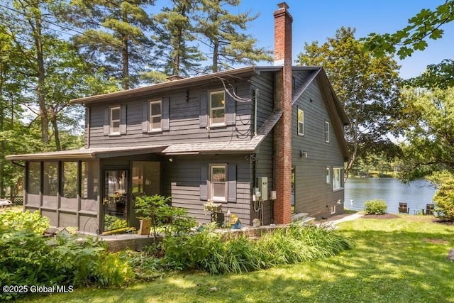 162 Methodist Farm Rd, Sand Lake, NY 12018 - back of house with a chimney, a yard, a water view, and a sunroom