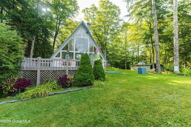 17 Oak Cir, Day, NY 12835 - rear view of property featuring a deck and a lawn