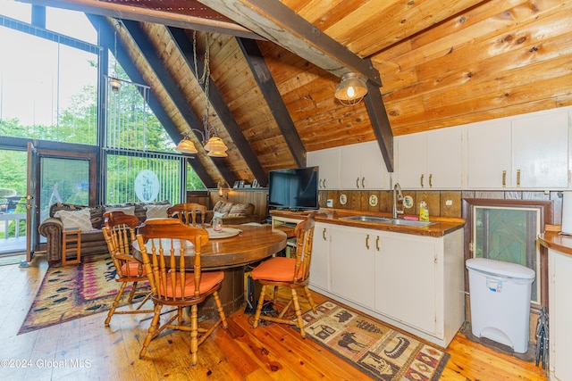 17 Oak Cir, Day, NY 12835 - dining area featuring light wood finished floors, healthy amount of natural light, and wooden ceiling