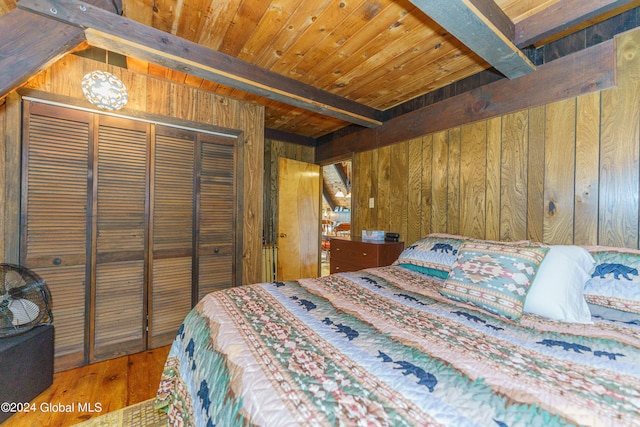 17 Oak Cir, Day, NY 12835 - bedroom with wood walls, wood finished floors, a closet, and a wooden ceiling with exposed beams
