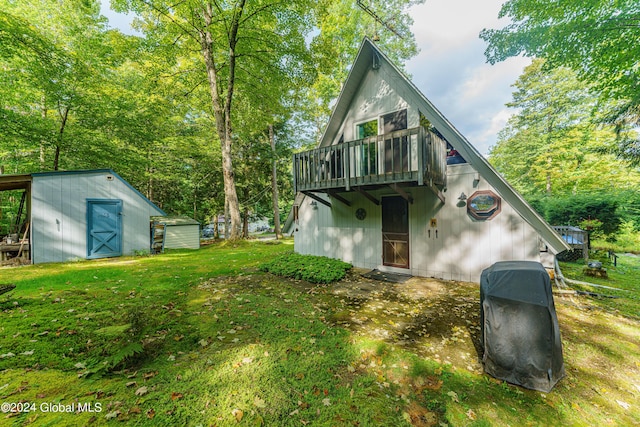 17 Oak Cir, Day, NY 12835 - rear view of house featuring a shed and a lawn