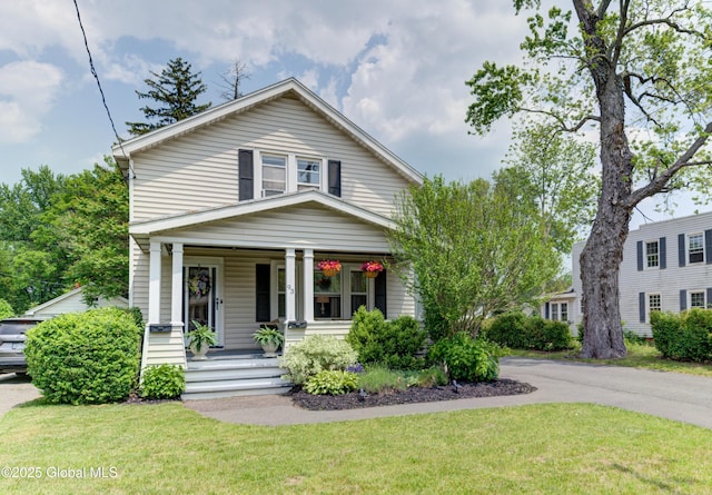 93 Sand Creek Rd, Colonie, NY 12205 - view of front of house with covered porch and a front yard