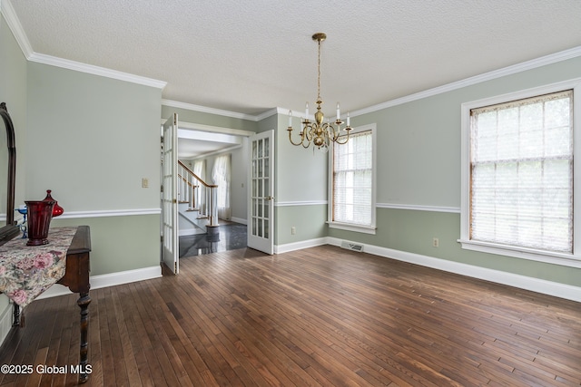 987 Grooms Rd, Rexford, NY 12148 - unfurnished room featuring a chandelier, stairs, hardwood / wood-style flooring, a textured ceiling, and crown molding