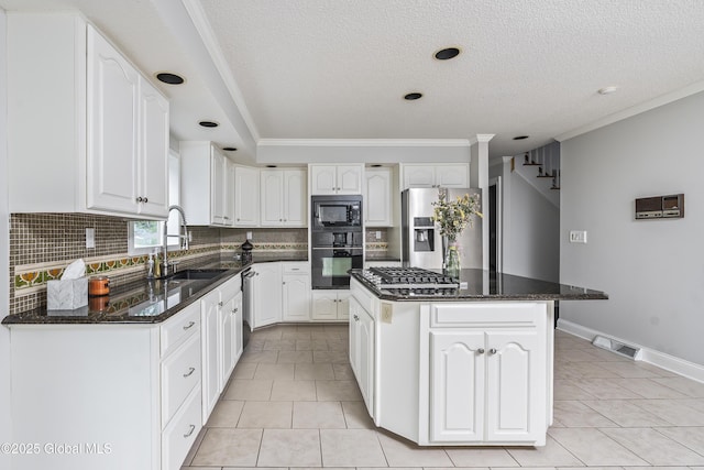 987 Grooms Rd, Rexford, NY 12148 - kitchen featuring black appliances, a sink, tasteful backsplash, a center island, and ornamental molding