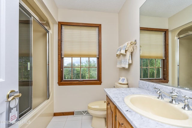 987 Grooms Rd, Rexford, NY 12148 - full bath with tile patterned floors, toilet, vanity, baseboards, and shower / bath combination with glass door