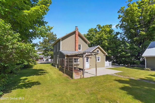 784 Ny Highway 351, Poestenkill, NY 12140 - back of property with a pergola, a patio area, a yard, and a chimney