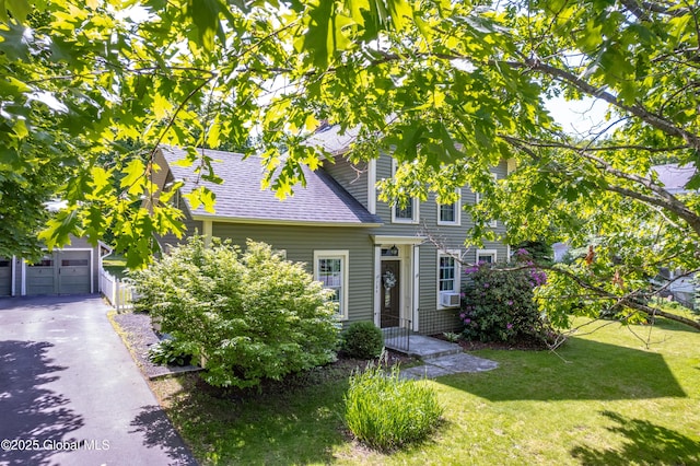 784 Ny Highway 351, Poestenkill, NY 12140 - view of front facade featuring a front yard, a garage, a shingled roof, cooling unit, and driveway