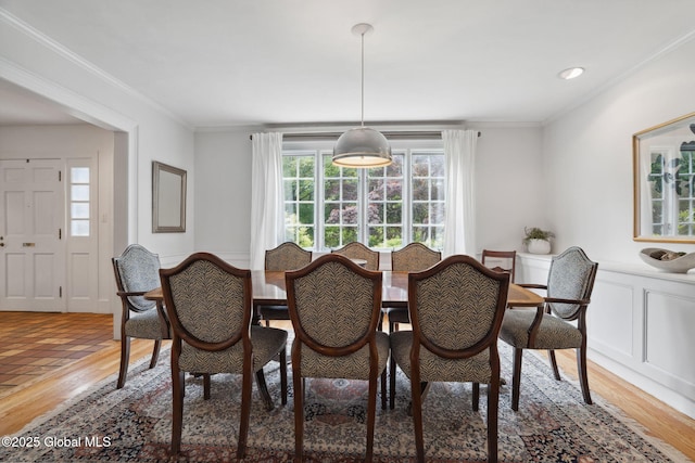 20 Darroch Rd, Bethlehem, NY 12054 - dining area featuring ornamental molding, light wood-style floors, and a wainscoted wall