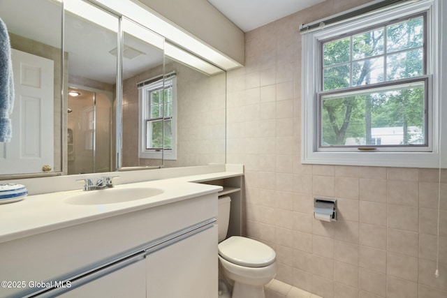 20 Darroch Rd, Bethlehem, NY 12054 - bathroom with tile walls, vanity, healthy amount of natural light, and an enclosed shower