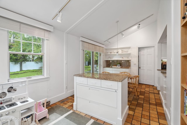 20 Darroch Rd, Bethlehem, NY 12054 - kitchen with rail lighting, open shelves, white cabinets, lofted ceiling, and pendant lighting