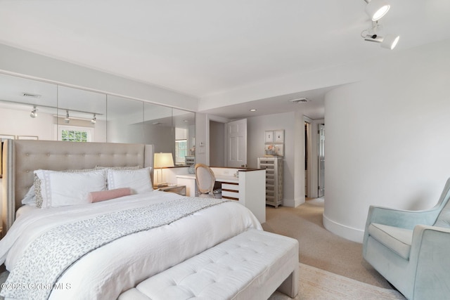 20 Darroch Rd, Bethlehem, NY 12054 - bedroom with light colored carpet and track lighting