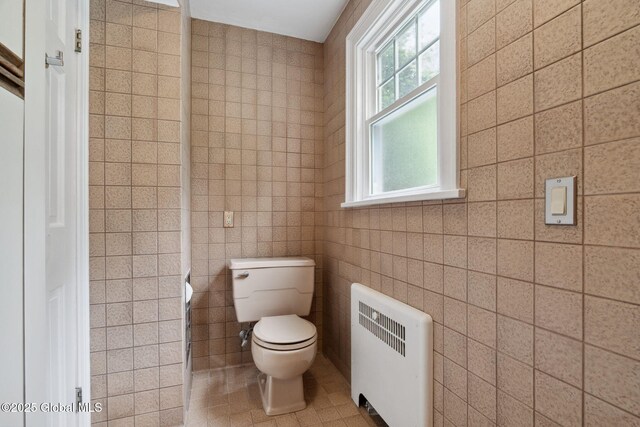 20 Darroch Rd, Bethlehem, NY 12054 - bathroom featuring radiator heating unit and tile walls