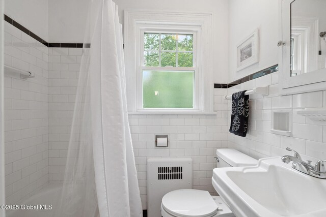 20 Darroch Rd, Bethlehem, NY 12054 - bathroom featuring radiator heating unit and tile walls