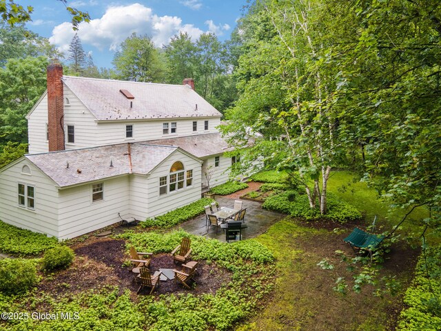 20 Darroch Rd, Bethlehem, NY 12054 - rear view of property featuring an outdoor fire pit, a chimney, and a patio area