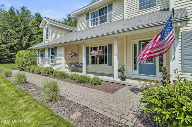 9 Oakline Ct, Niskayuna, NY 12309 - property entrance with covered porch and roof with shingles