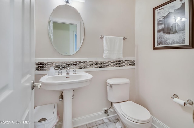 9 Oakline Ct, Niskayuna, NY 12309 - half bath with toilet, tile patterned flooring, and baseboards
