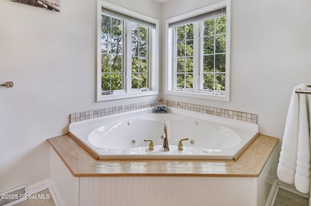9 Oakline Ct, Niskayuna, NY 12309 - full bathroom featuring a whirlpool tub and baseboards