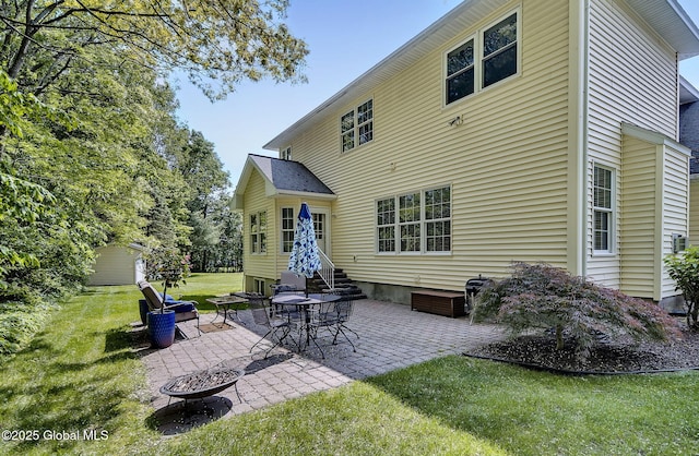 9 Oakline Ct, Niskayuna, NY 12309 - back of house featuring a fire pit, a patio, a yard, and entry steps