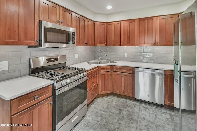 14 Woodridge Rd, Bethlehem, NY 12054 - kitchen featuring stainless steel appliances, light countertops, backsplash, brown cabinets, and recessed lighting