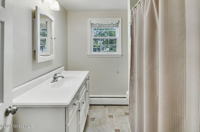 14 Woodridge Rd, Bethlehem, NY 12054 - bathroom featuring a baseboard radiator, vanity, and a shower with curtain