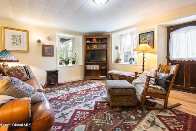 98 George St, Fort Ann, NY 12827 - sitting room featuring healthy amount of natural light and wood finished floors