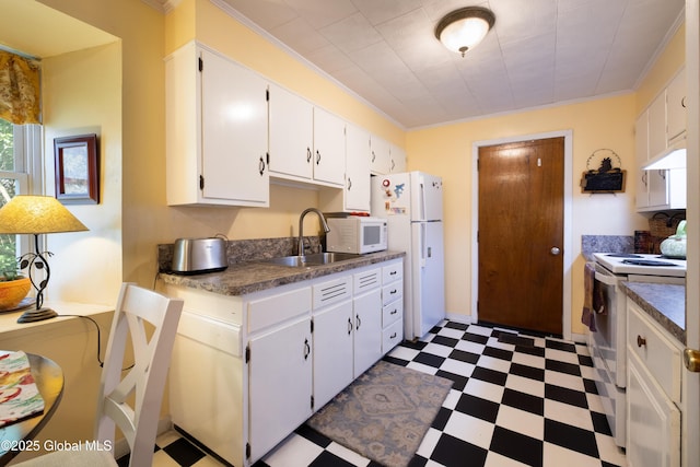 98 George St, Fort Ann, NY 12827 - kitchen with white appliances, dark flooring, a sink, ornamental molding, and white cabinetry