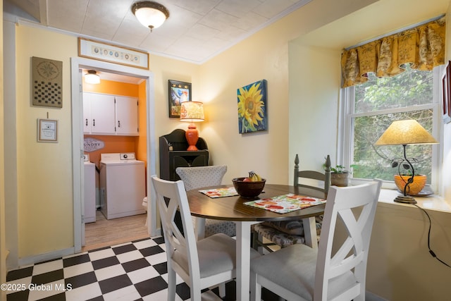 98 George St, Fort Ann, NY 12827 - dining area featuring washing machine and dryer, light flooring, and crown molding