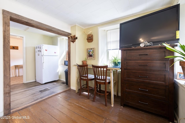 98 George St, Fort Ann, NY 12827 - dining room with dark wood-type flooring, crown molding, and baseboards