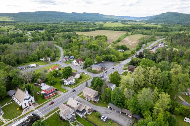 98 George St, Fort Ann, NY 12827 - aerial view of a mountain backdrop and a heavily wooded area