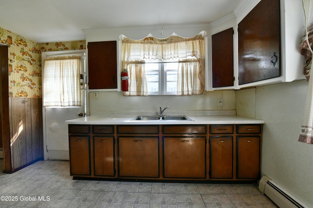 102 Willow St, Guilderland, NY 12084 - kitchen featuring a baseboard radiator, a sink, and light countertops