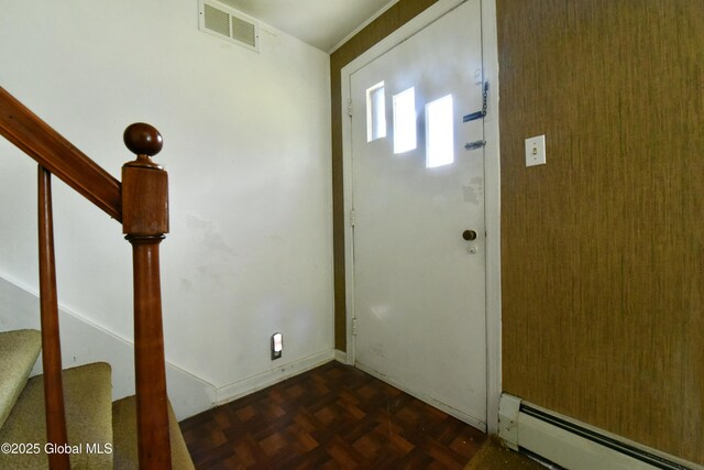 102 Willow St, Guilderland, NY 12084 - entrance foyer featuring a baseboard radiator, stairs, and baseboards