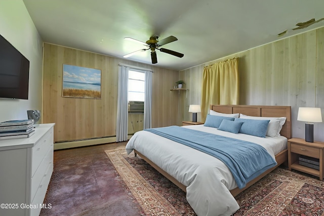 102 Willow St, Guilderland, NY 12084 - bedroom featuring baseboard heating, wood walls, a ceiling fan, and dark carpet