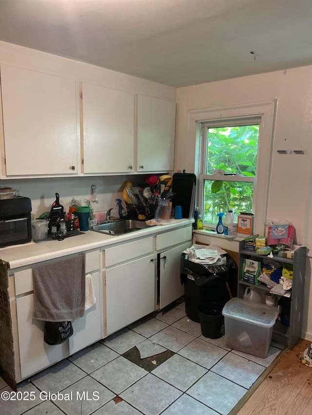 1199 State Route 30a, Esperance, NY 12035 - kitchen with light countertops, white cabinets, and a sink